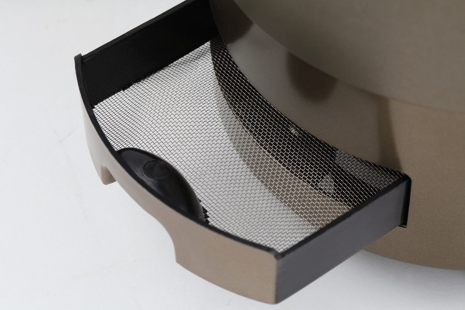 Close-up view of the fine black mesh insect catch net installed in the bronze/gold colored housing of the W-B series mosquito control lamp, designed for easy removal and cleaning.